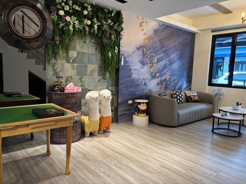 a living room with a pool table and a couch at Villa Ten - Catch up in Guilin