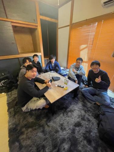 a group of people sitting around a table at コハクイマバリ in Imabari