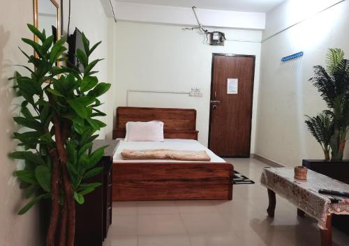 Postel nebo postele na pokoji v ubytování Hotel Labbaik Farmgate