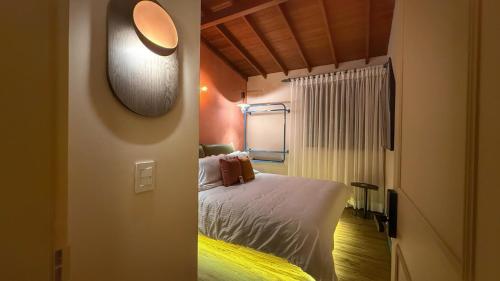 Postel nebo postele na pokoji v ubytování Autenthico Provenza Hotel Medellin