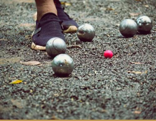 a person in purple shoes and balls on the ground at Les 3 Chalets de Cilaos in Cilaos