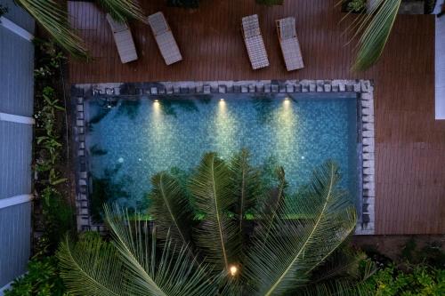 an overhead view of a swimming pool with lights at Kandakuliya Sunrise Beach Villas in Kalladi