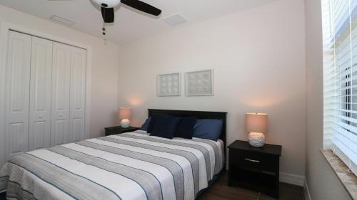 a bedroom with a bed with two night stands and two lamps at TYC8330 in Bethlehem
