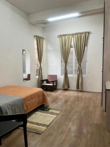 Ένα ή περισσότερα κρεβάτια σε δωμάτιο στο Chawng Homestay