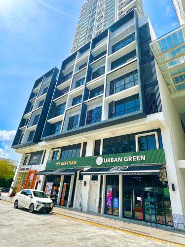 a building with a car parked in front of it at EcoNest 3Bedroom Family Apartment 8px Near Legoland in Iskandar Puteri