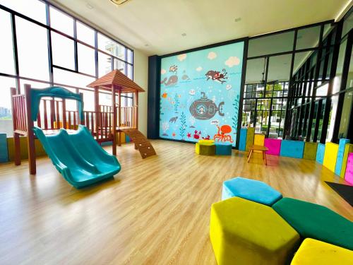 a childrens room with a play area with a slide at EcoNest 3Bedroom Family Apartment 8px Near Legoland in Iskandar Puteri