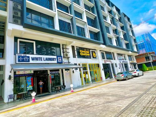 a building with a white library on a street at EcoNest 3Bedroom Family Apartment 8px Near Legoland in Iskandar Puteri