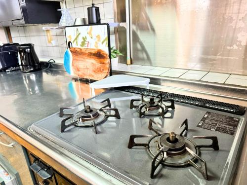 Dapur atau dapur kecil di 石垣島グループの宿 2216 にじいろ ユーグレナモール内