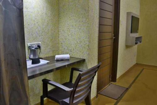 a chair sitting at a counter in a room at Luxury Aveeno Resort Near Calangute and Baga in Sangolda
