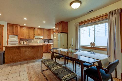 a kitchen with a table and chairs and a dining room at The Bend House in Bend