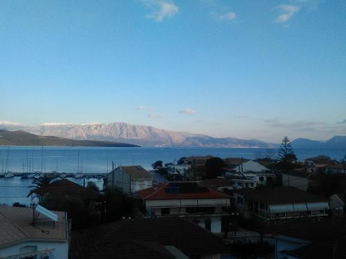 a city with a view of the water and mountains at Hotel Pegasos in Nikiana