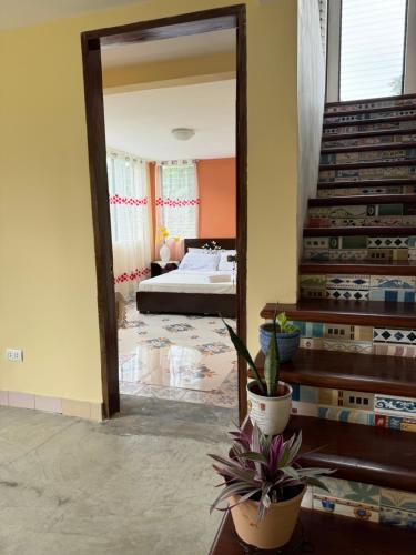 a large mirror in a room with a bedroom at CasaLinda Homestay in Agoho