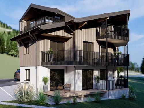 a rendering of a building with balconies at Bergzeit flat Saalbach directly on the ski piste in Saalbach Hinterglemm