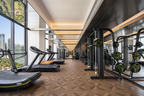 a gym with treadmills and exercise equipment in a building at 重庆Indition英迪逊酒店江北嘴金融城店 in Chongqing