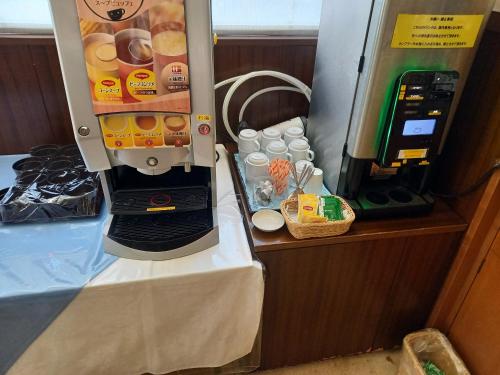 a drink machine on a boat with a drink dispenser at ホテルクニミ鴨宮 in Odawara