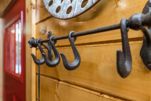 a group of horseshoes hanging on a wall at Creeksong Cabin in Rogers
