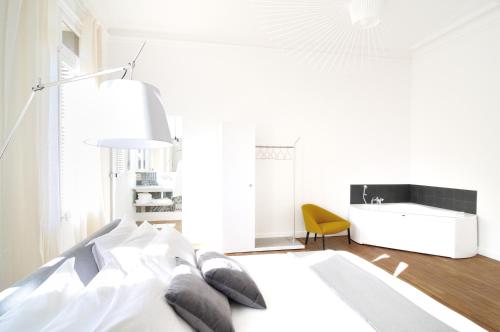 Cama o camas de una habitación en L'Hôtel Particulier Beziers