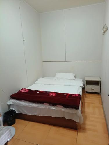 Postel nebo postele na pokoji v ubytování Shuyue Inn