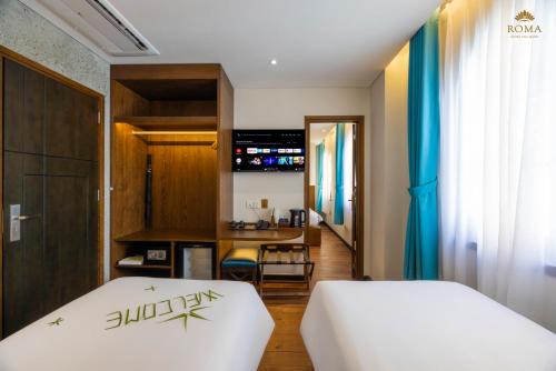 Roma Hotel Phu Quoc - Free Airport Shuttle & Sunset Town Tourにあるベッド
