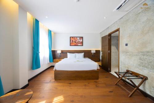 Roma Hotel Phu Quoc - Free Airport Shuttle & Sunset Town Tourにあるベッド