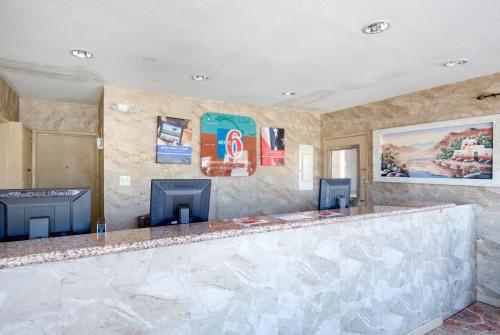 a bar in a room with a fireplace at Motel 6-Santa Fe, NM - Downtown in Santa Fe