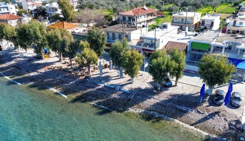 an aerial view of a town next to the water at ORIZONTAS Seaview Maisonette in Monodhéndrion