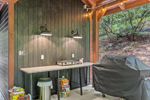 an outdoor kitchen with a counter in a house at Creekside in Rogers