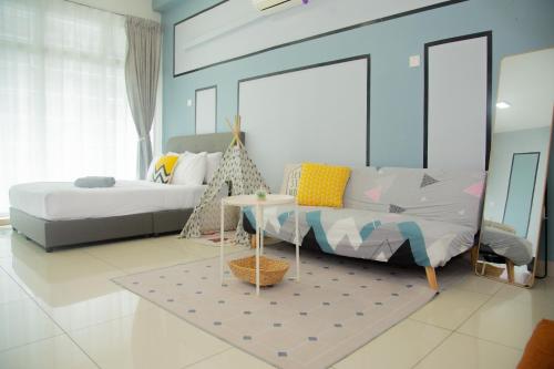 a bedroom with two beds and a table in it at Mount Austin IKEA, AEON 10mins -Pool View- B122 in Johor Bahru