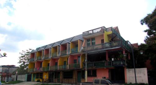 a building with balconies on the side of it at Hotel Mirador del Lago in Flores