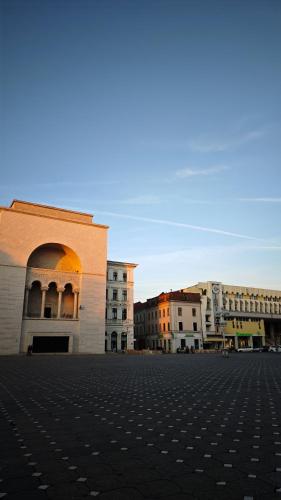 a group of buildings in a parking lot at Neuhausz Residenz Ultra-Central Apartment in Timişoara