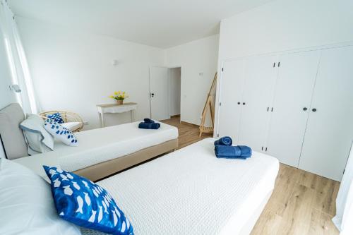 Katil atau katil-katil dalam bilik di Brisa do Mar - Apartments - T1 with Garden & AC near the Sea, Lagos