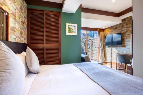 Ένα ή περισσότερα κρεβάτια σε δωμάτιο στο Centurion Hotel Residential Akasaka Station