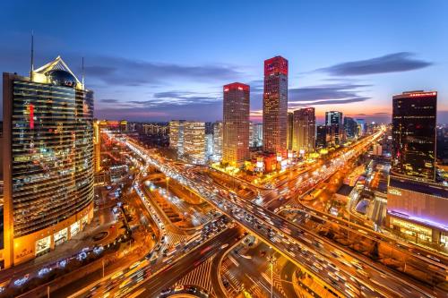 a city skyline at night with traffic at Dasein Youlan Hotel-Near the Forbidden City, Tiananmen Square, Guijie Street, Beihai Park, Jingshan Park, and Yonghe Temple in Beijing
