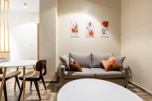 a living room with a couch and a table at BIRD NEST Near Arkan Plaza in Cairo