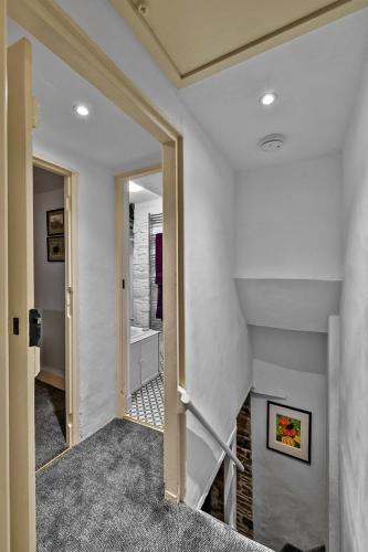 a hallway with a staircase in a house at Finest Retreats - Bre Stefan in Launceston