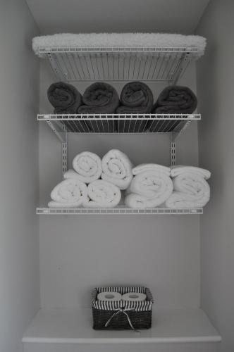 a bunch of donuts on a shelf in a refrigerator at Morley's in Stithians
