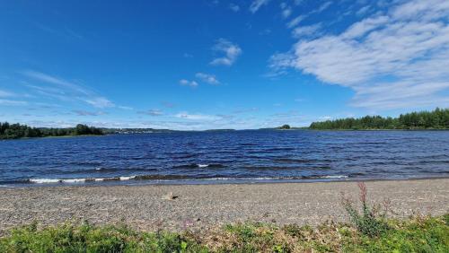 a view of a large body of water at Stuga Björn - Quiet cabin at lake Edesjön in Hammerdal
