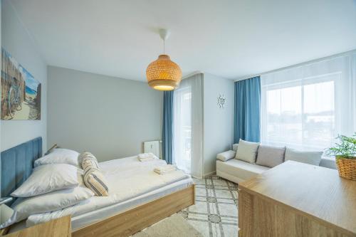 Posteľ alebo postele v izbe v ubytovaní Apartament Reymonta 15 SurfingBird Kołobrzeg