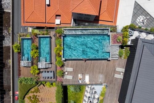 an overhead view of a swimming pool in a building at Savoy Insular V by An Island Apart in Funchal