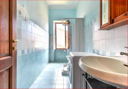a bathroom with a sink and a toilet at Casa Martina a Porto Azzurro in Porto Azzurro