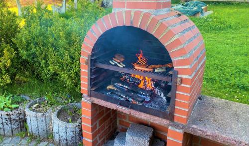 a brick oven with a fire inside of it at Süßen Häusle in Breitnau
