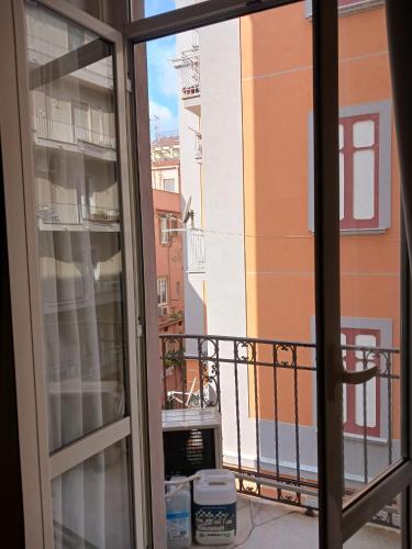 a view of a balcony from a window at Seawall Holiday Home in Salerno