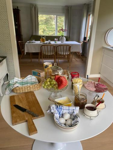 a white table with a bunch of food on it at Valberg Gjestegård in Valberg