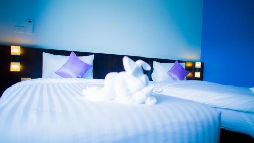 Aziss Boutique Hotel - SHA Plusにあるベッド