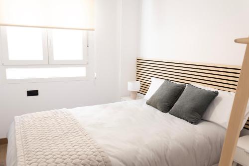 Ένα ή περισσότερα κρεβάτια σε δωμάτιο στο Apartamentos Yakka