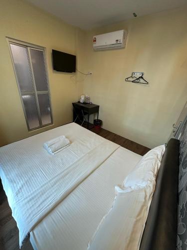 Postel nebo postele na pokoji v ubytování Serian Transit Inn