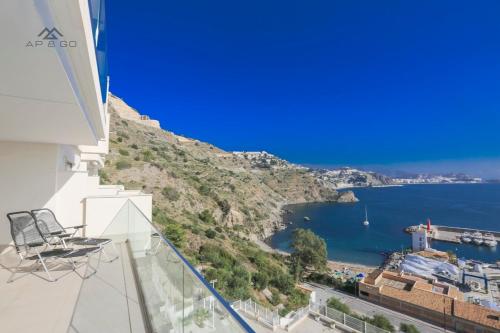 a view of the ocean from a balcony of a building at Icon Luxury Seaview Marina in Almuñécar