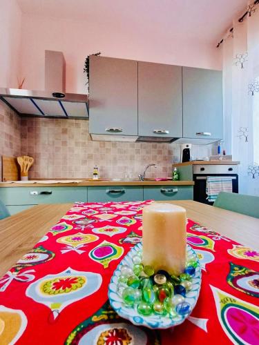 a candle sitting on top of a table in a kitchen at Tolstoi 83 Apartment in Milan