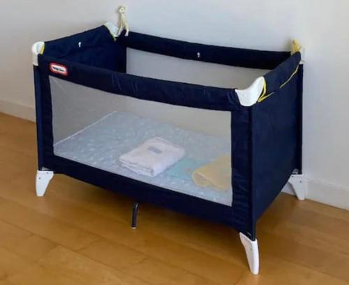 a small blue shelf with a towel on it at Maison Eysines- A10 in Eysines