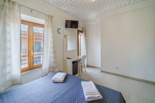 Letto o letti in una camera di La Terrazza sul Mare - Elba Affitti